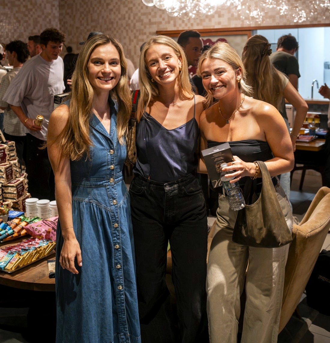 Three women smiling together at High Fiber Night