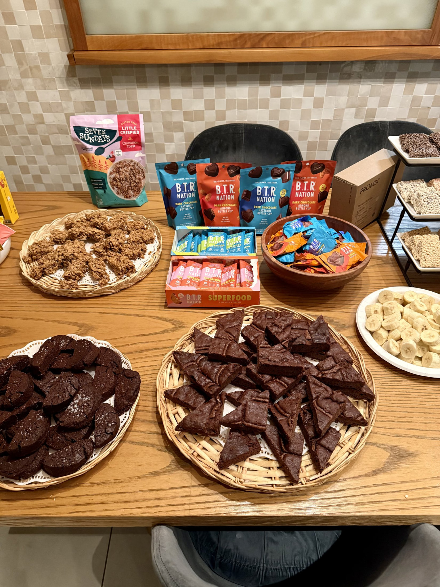 Products and samples laid out on a wood table at an event