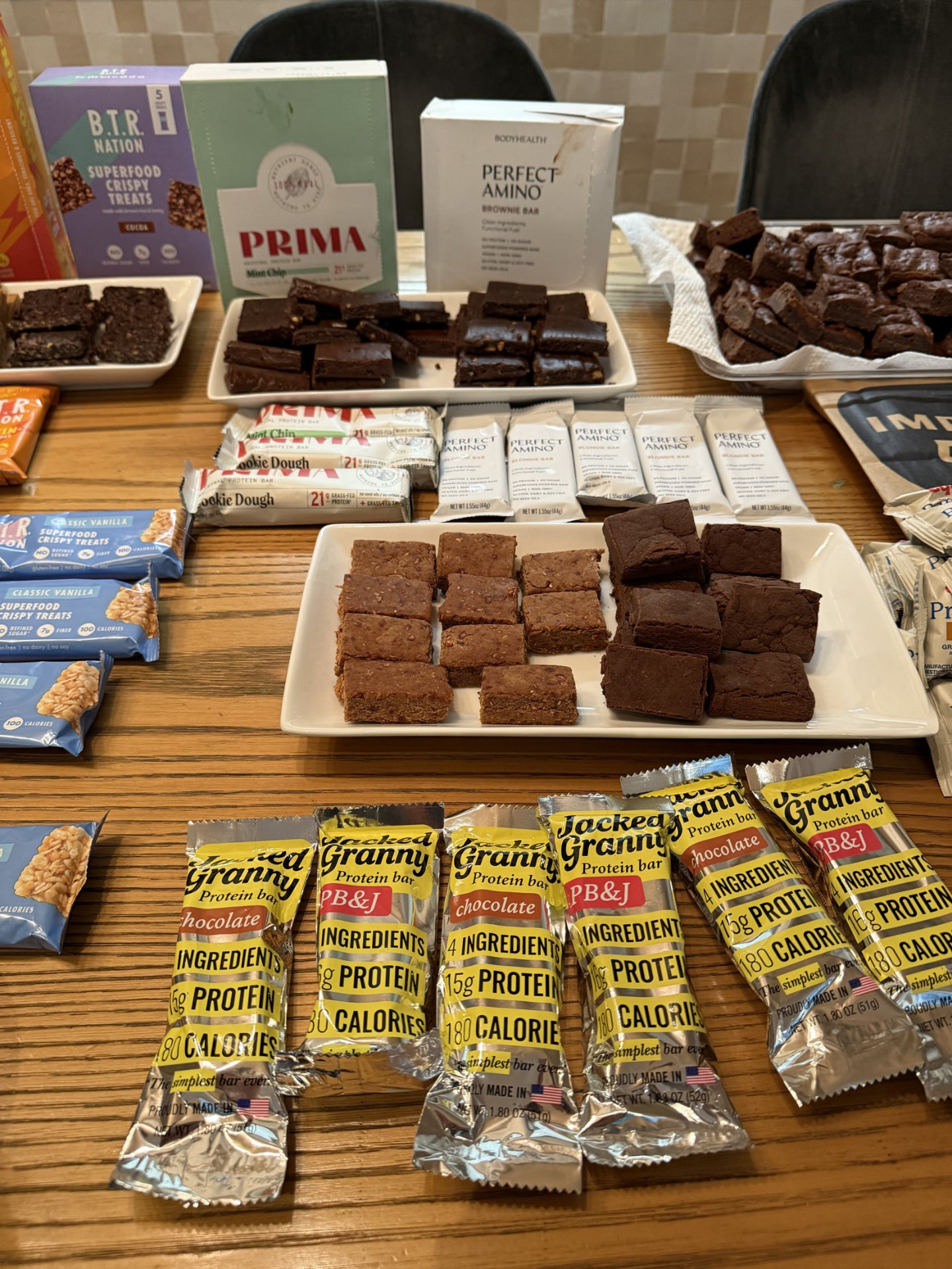 Protein bars and brownies laid out on a table at an NYC Health Collective event